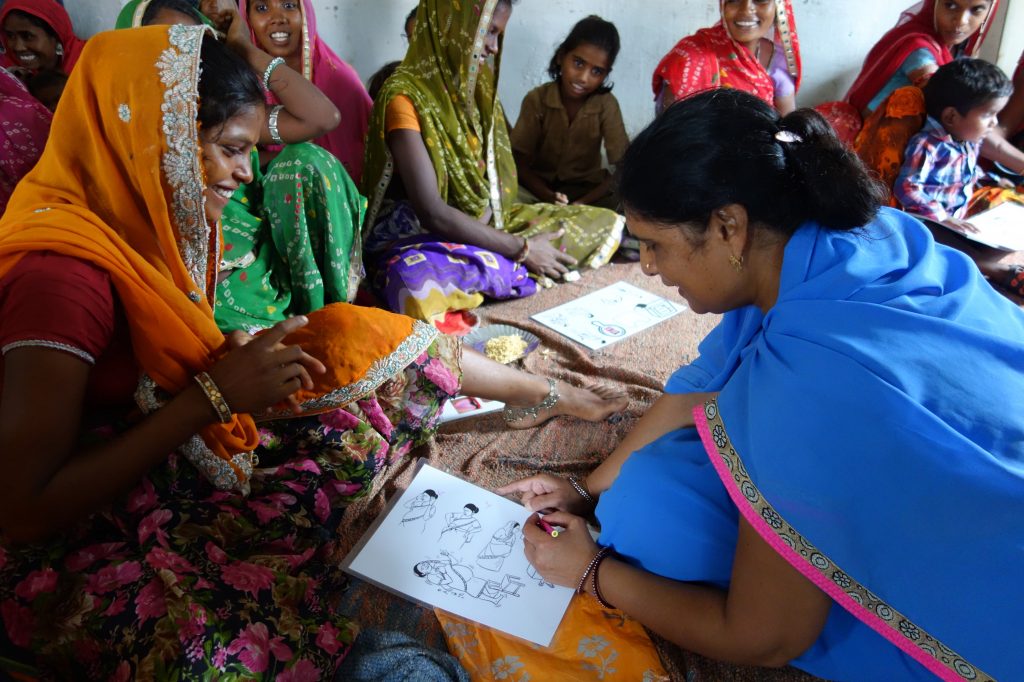 Woman in India receiving prenatal instructions.